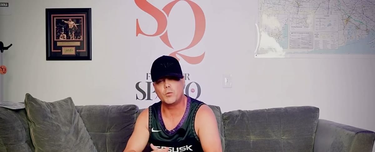 A seated interview subject during the Question 8 documentary