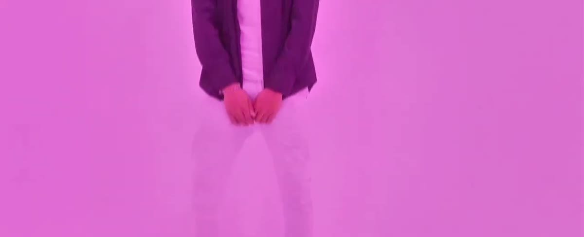 A bold pink graphic frame from the Adrenaline Rush music video