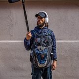 Bella Amity sound recordist with a boom mic
